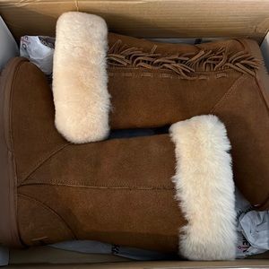 Minnetonka mid calf boots. Only worn once and in perfect condition.